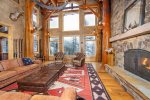The rustic Great Room is an incredible gathering space for the group with beautiful mountain views overlooking Whitefish Mountain Resort.